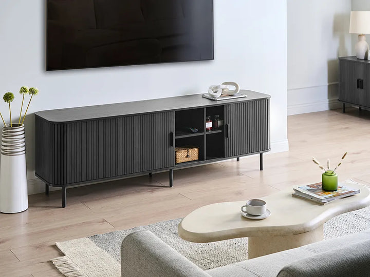 Modern living room with a gray TV stand, coffee table, and sofa.