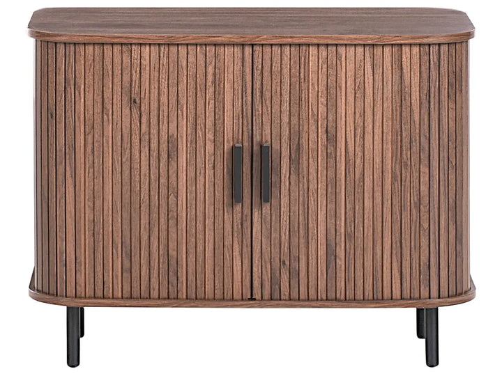 A mid-century modern wooden sideboard cabinet with vertical fluted doors, rounded corners, and black metal legs and handles, shown against a plain white background.