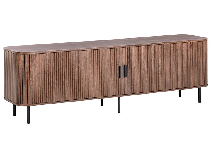 A modern long sideboard cabinet with a curved front, vertical wood slat panel doors, two black handles, and slim black legs, shown on a plain white background.