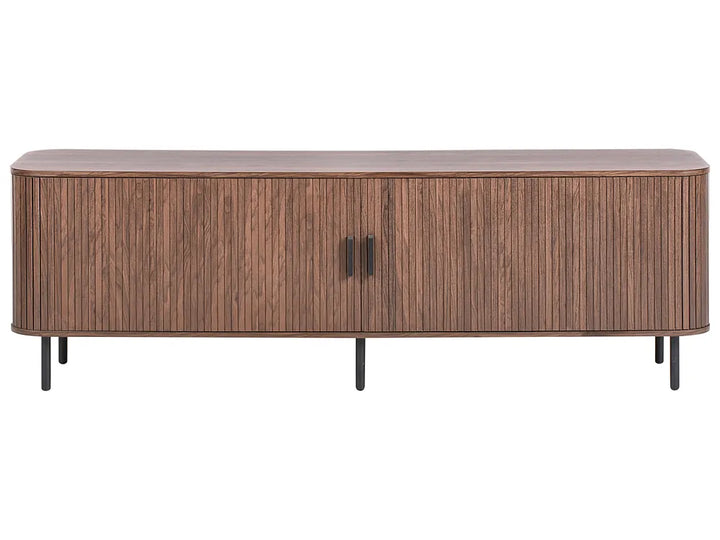 A modern wooden sideboard or media console with a fluted vertical wood grain pattern, two doors with slim black handles, and four tapered black legs, shown against a plain white background.