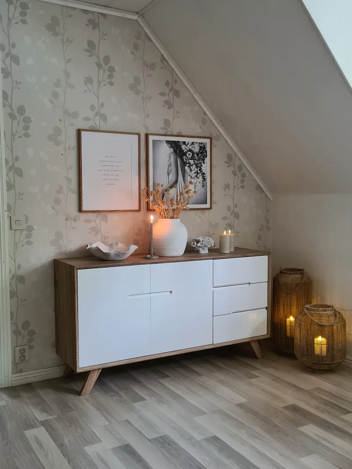 White storage cabinet with light wood accents