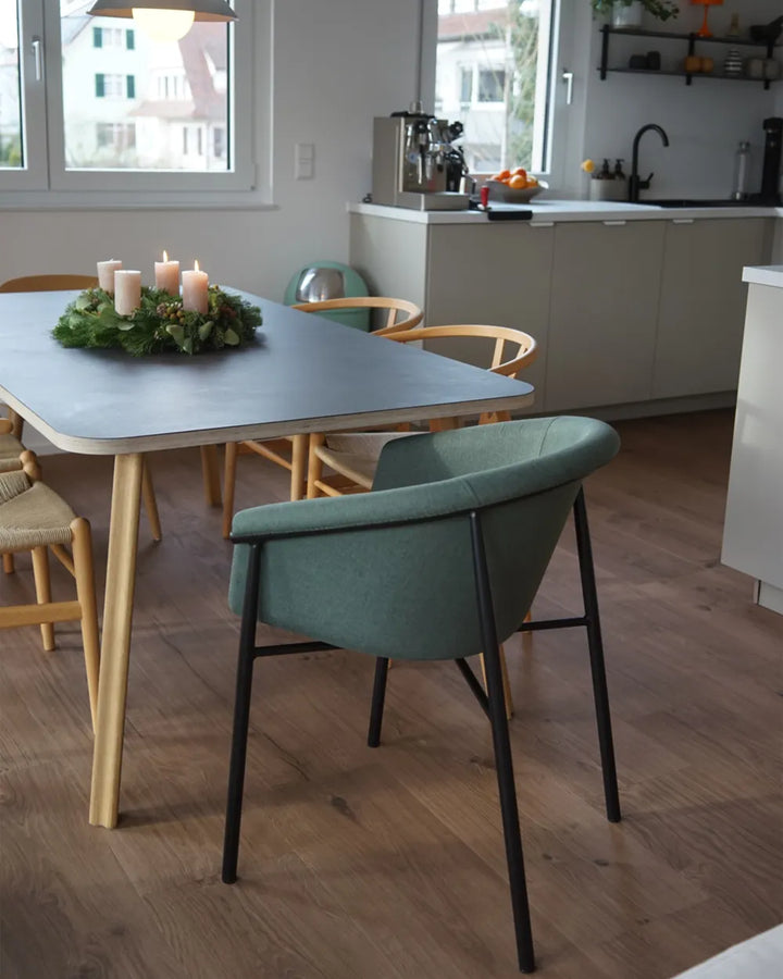 Dining area with a table and chairs in a kitchen setting