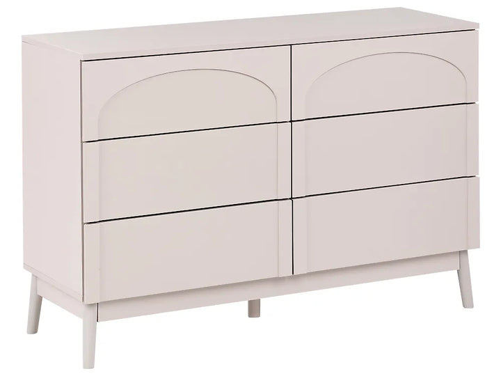 A six-drawer dresser in a light cream or off-white finish, featuring arched drawer fronts and tapered legs, shown against a plain white background.