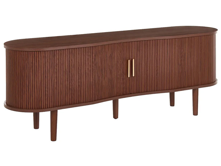 A mid-century modern sideboard cabinet with a curved, elongated oval shape, featuring a fluted wood-grain front, tapered legs, and two vertical gold metal handles.