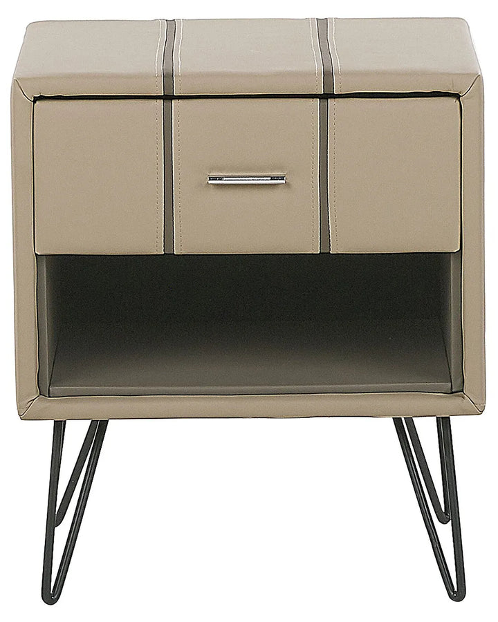A modern two-drawer nightstand with a beige faux leather finish, featuring vertical stitched details, a silver metal pull handle, and black hairpin legs.