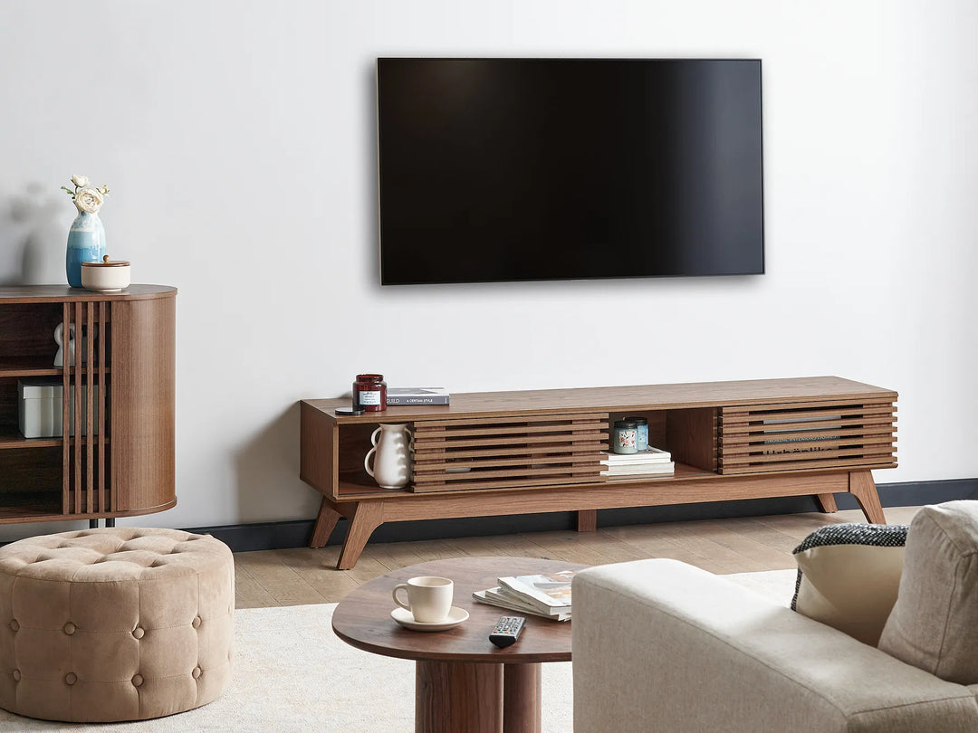 A mid-century modern wooden TV stand or console table with a single drawer.