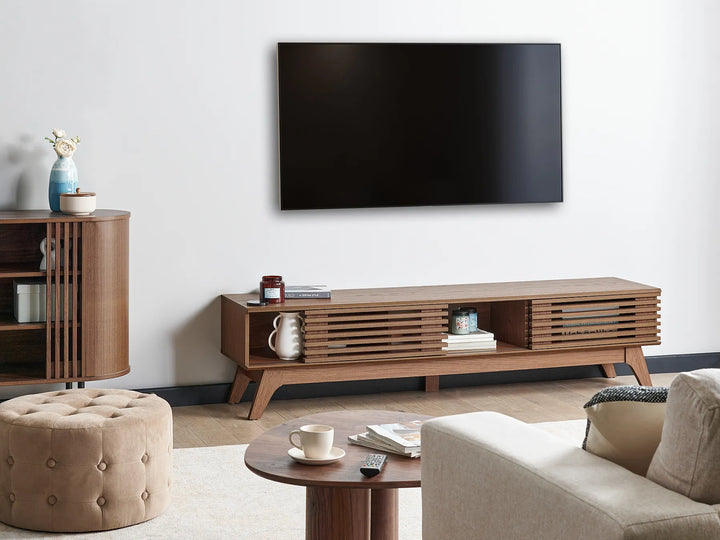 A mid-century modern wooden TV stand or console table with a single drawer.
