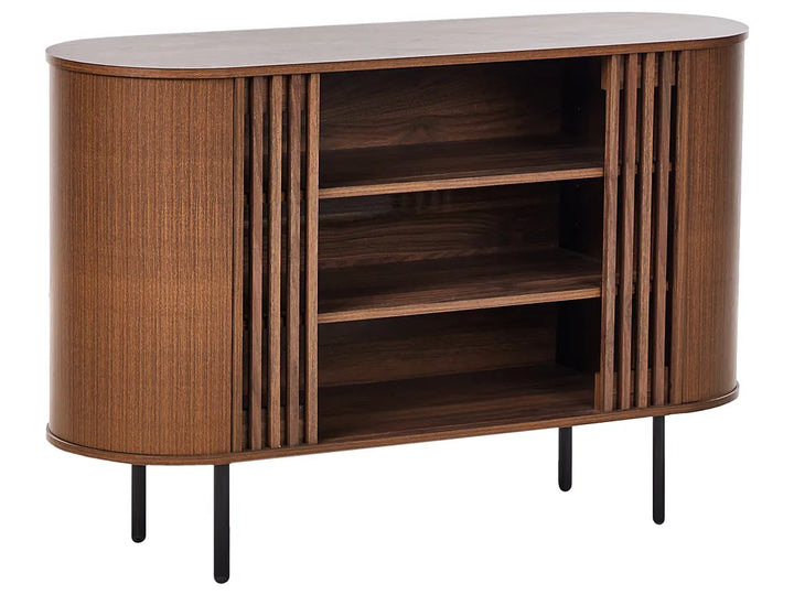 A mid-century modern wooden sideboard cabinet with a curved oval shape, featuring vertical fluted wood panels on the sides, three open shelves, and slim black metal legs, shown against a plain white background.