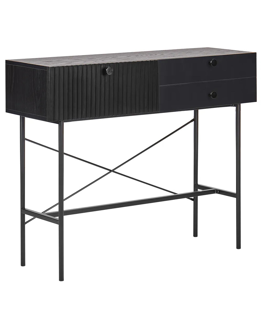 A modern black console table featuring a textured wood-grain top, a slatted cabinet door, two drawers on the right, and a slim metal frame with crisscrossing support legs.