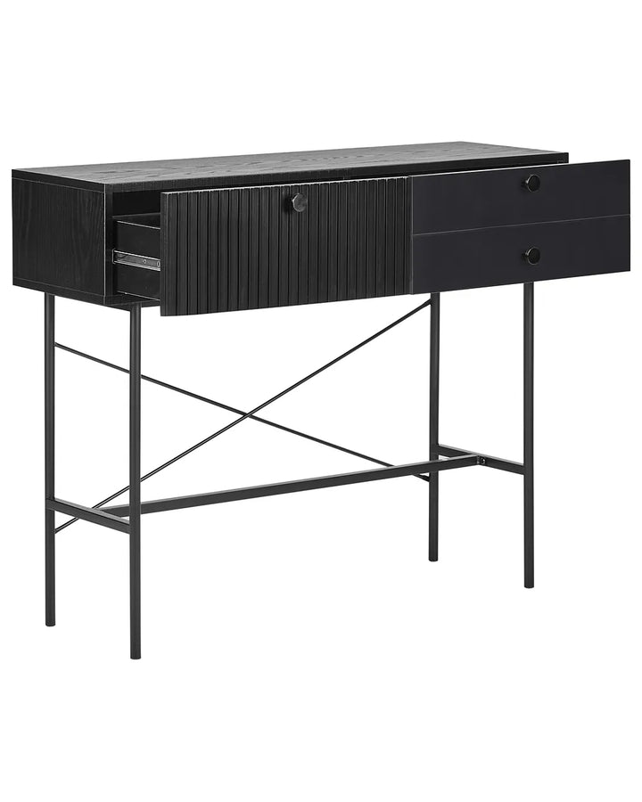 A modern black console table featuring a textured wood top, a ribbed drawer front, and a slim metal frame with crisscrossing legs.