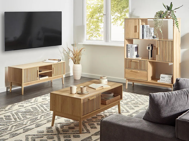Modern living room with wooden furniture, TV, and decor.