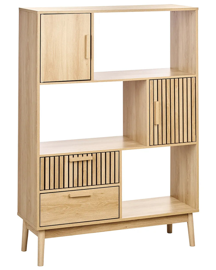 A mid-century modern wooden storage cabinet with a light oak finish, featuring a single door, slatted door compartments, and a drawer on a white background.