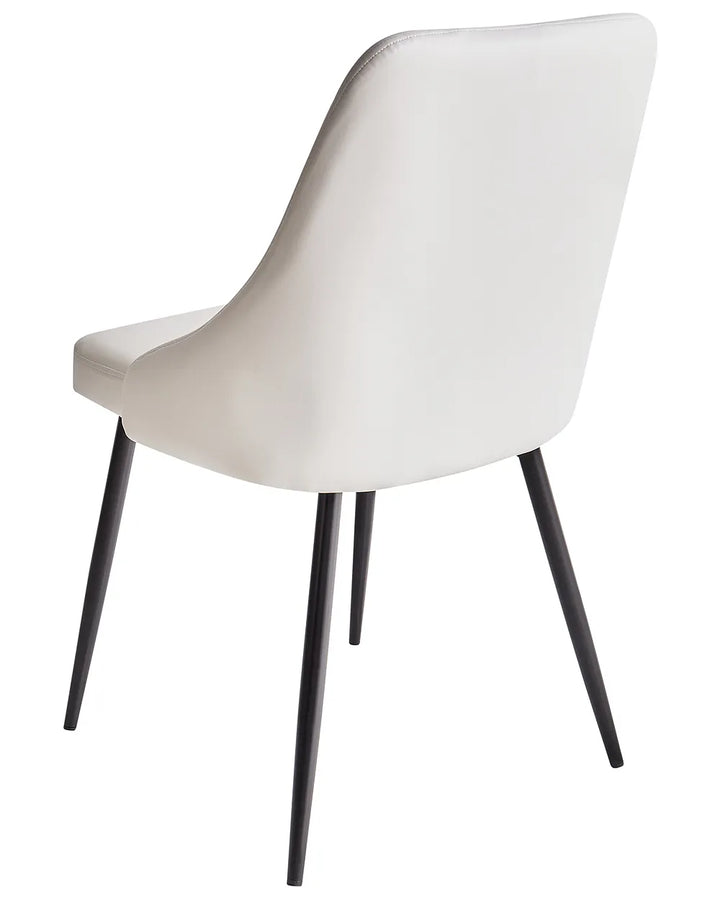 White chair with black legs on a white background