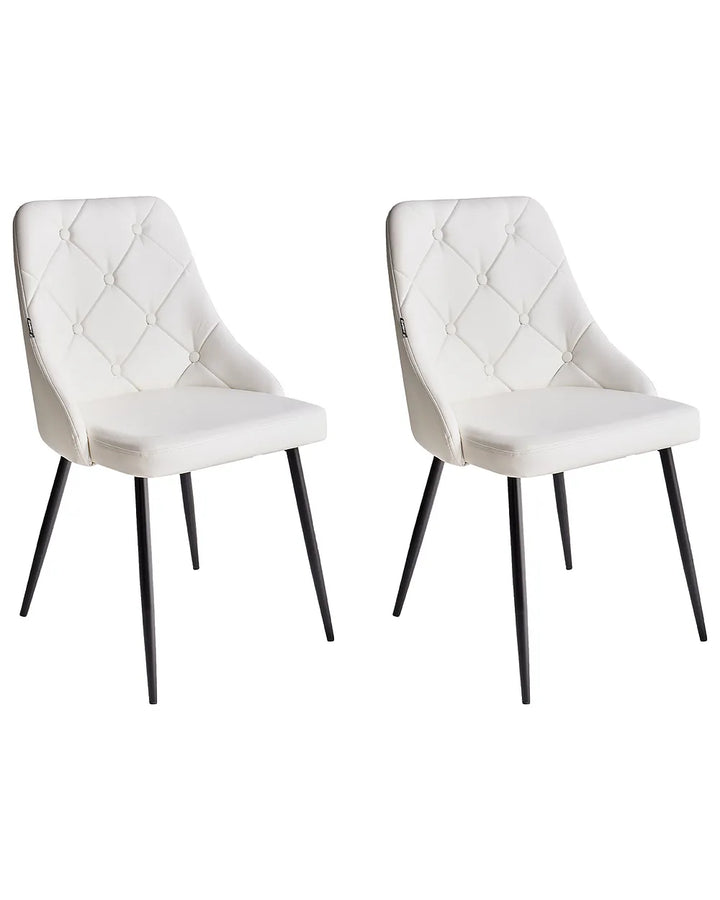 Two white upholstered chairs with black legs on a white background