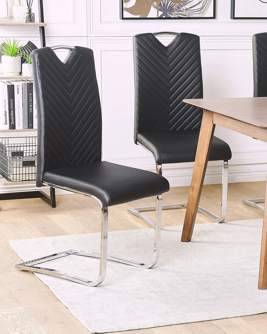 Black faux leather dining chairs with padded seats
