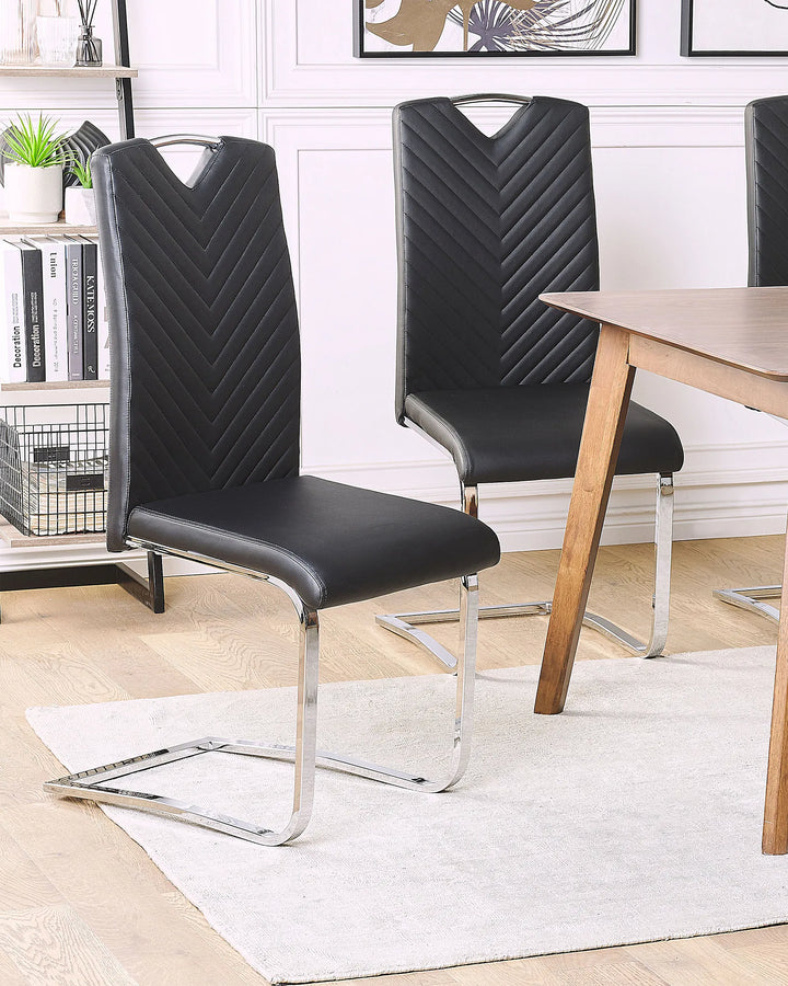Black faux leather dining chairs with padded seats