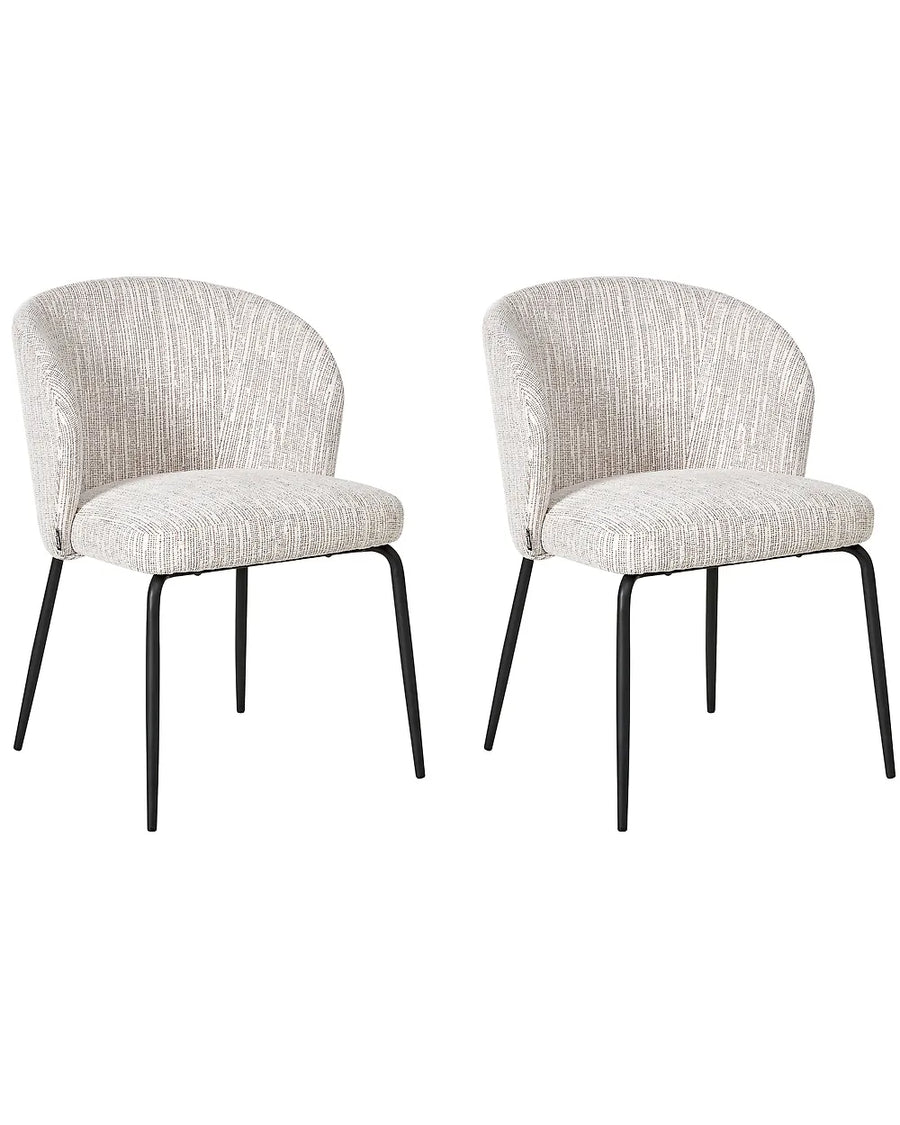 Two matching upholstered dining chairs with curved backs, textured light beige fabric seats, and slim black metal legs, shown on a plain white background.