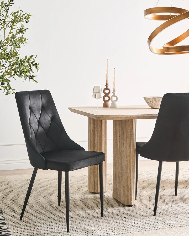Black velvet dining chairs with upholstered seats