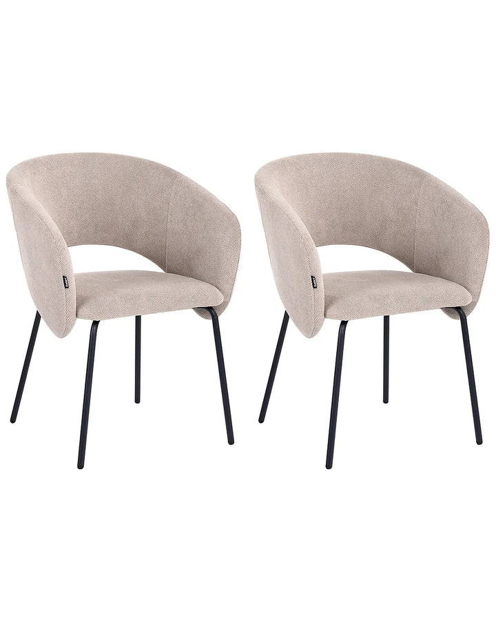 Two matching upholstered dining chairs with curved backs and slim black metal legs, shown side by side on a plain white background.