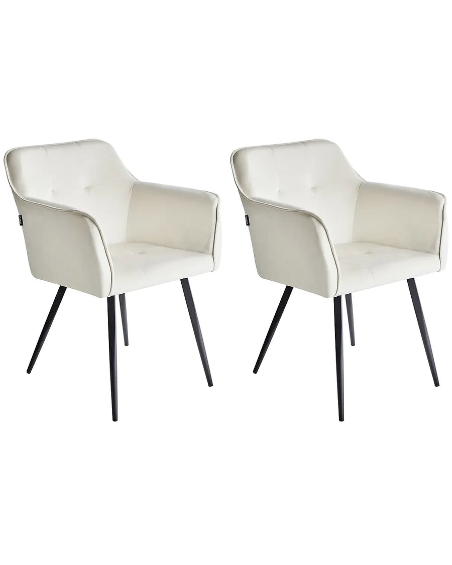 Two modern upholstered dining chairs with cream faux leather seats and black tapered legs, shown side by side on a white background.
