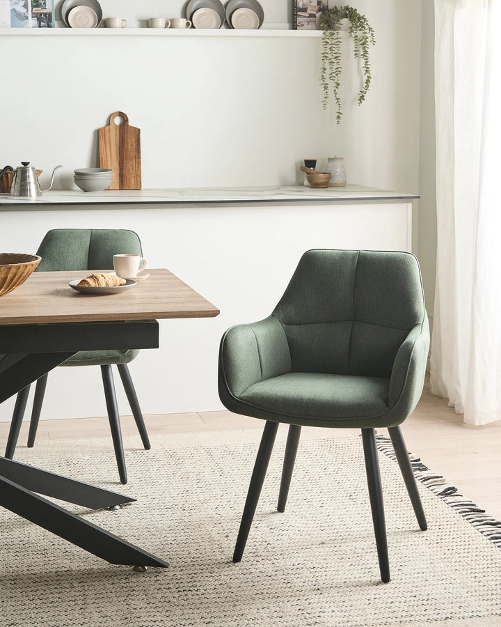 Green chair with black legs