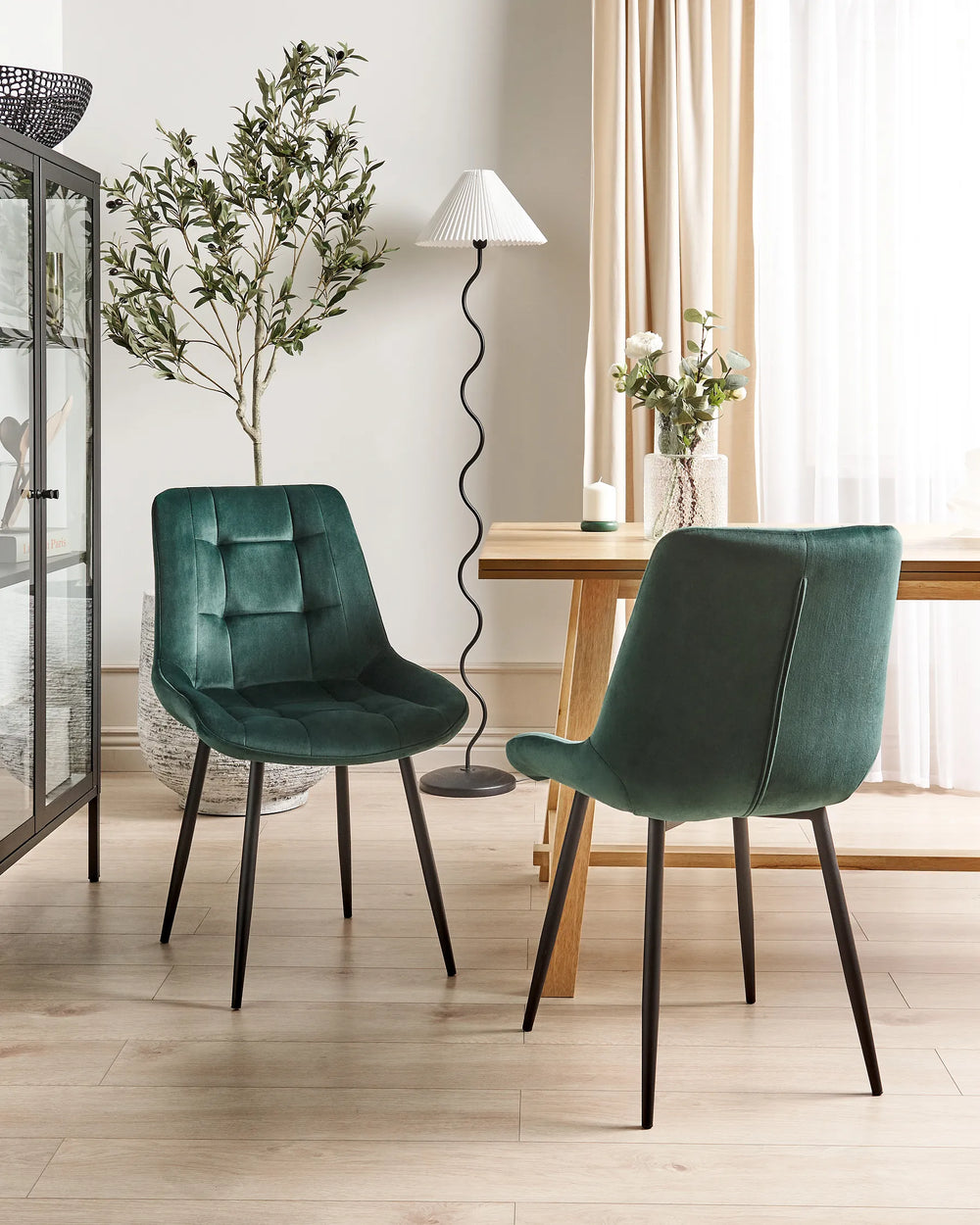 Dark green velvet chairs for modern dining room interiors