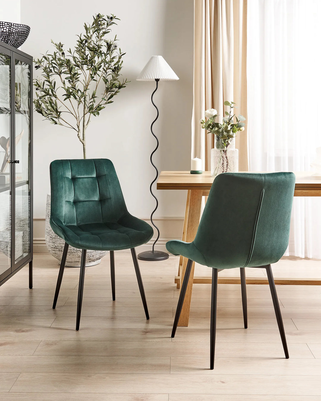 Dark green velvet chairs for modern dining room interiors