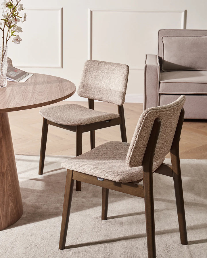 Dark brown dining chairs with taupe upholstered seats