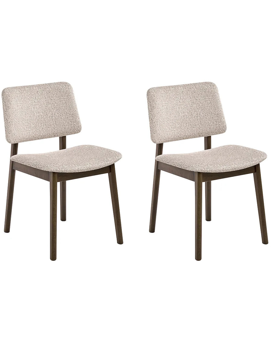 Two matching dining chairs with textured light beige bouclé upholstery and dark brown wooden legs, shown against a plain white background.