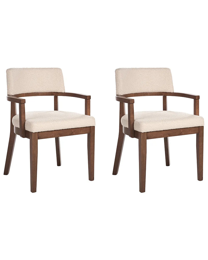 Two matching upholstered dining chairs with dark brown wooden frames and cream fabric seats and backs, shown on a plain white background.