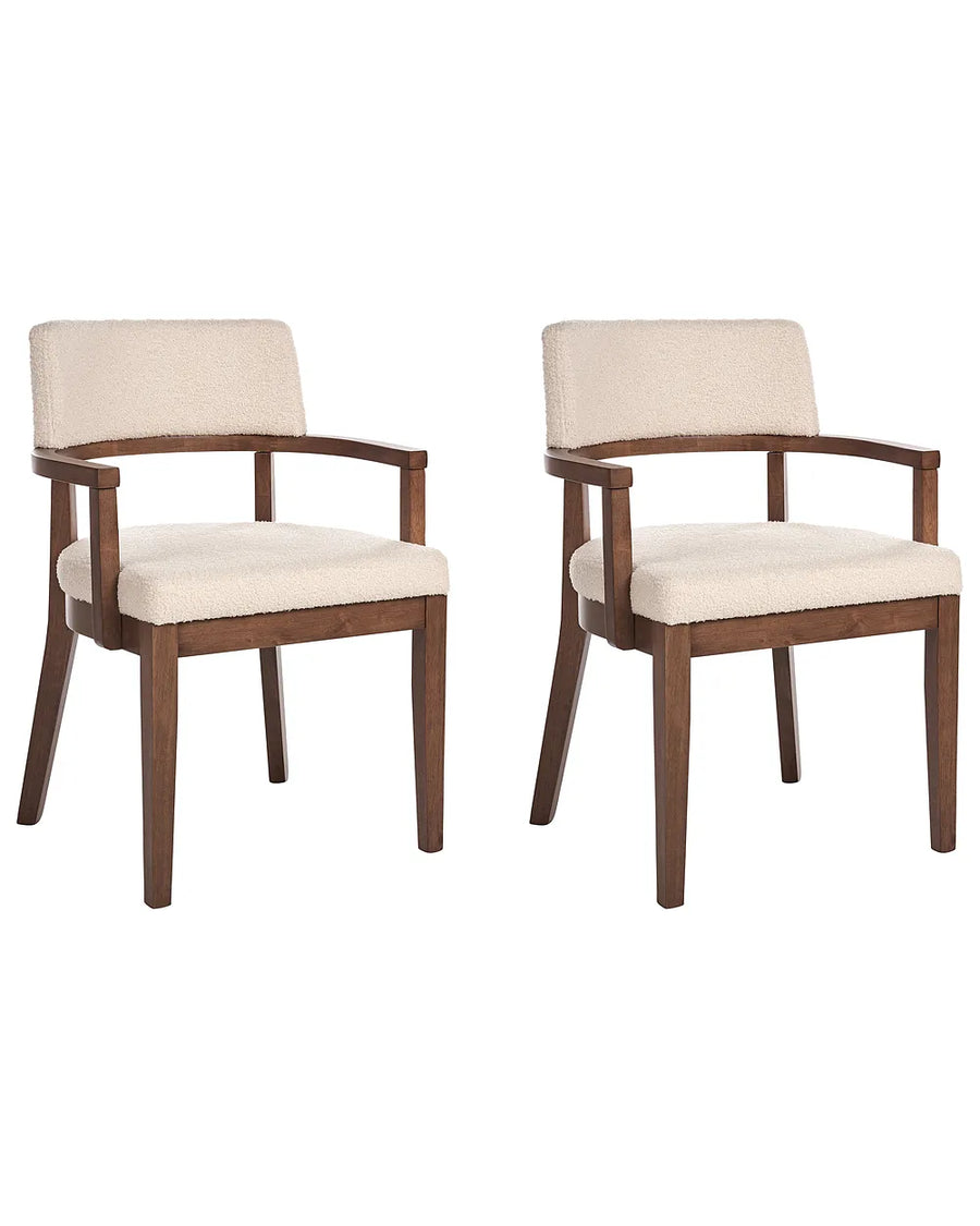 Two matching upholstered dining chairs with dark brown wooden frames and cream fabric seats and backs, shown on a plain white background.