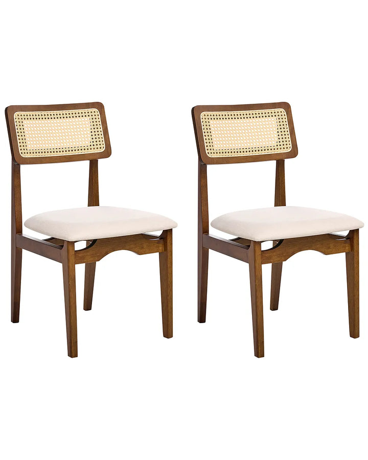 Two wooden dining chairs with woven cane backrests and cream upholstered seats, shown side by side on a plain white background.