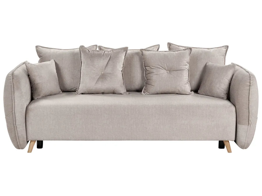 Beige sofa with multiple cushions on a white background
