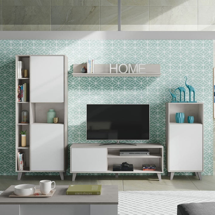 Modern living room with white furniture, TV, and decorative items against a patterned wall.