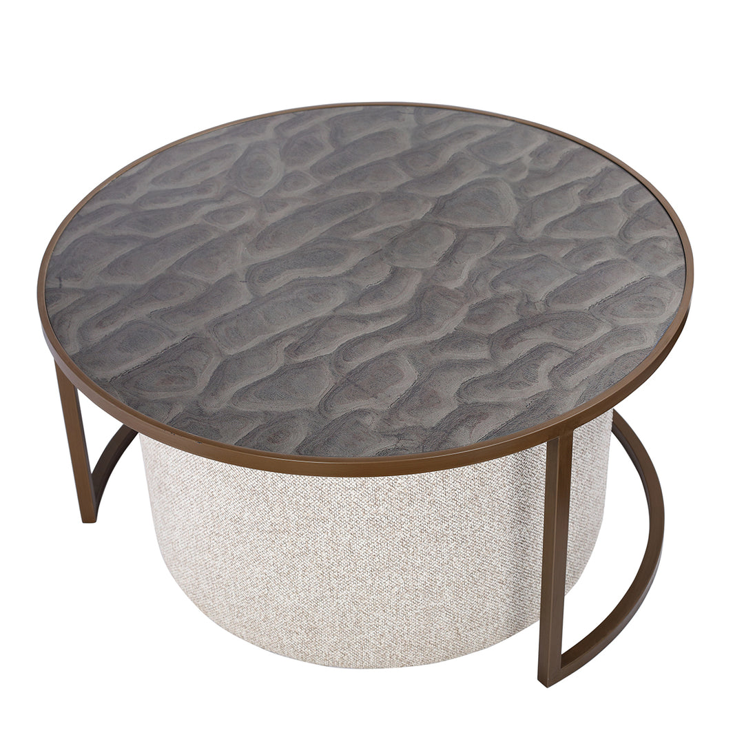 Round driftwood effect coffee table with textured ripple design and pouffe