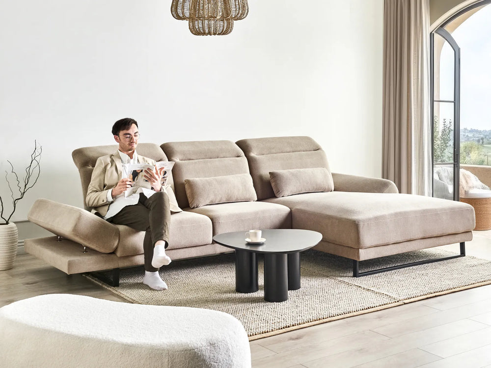 4‑seater taupe L‑shaped corner sofa with plush cushioning and adaptable armrests in modern living room