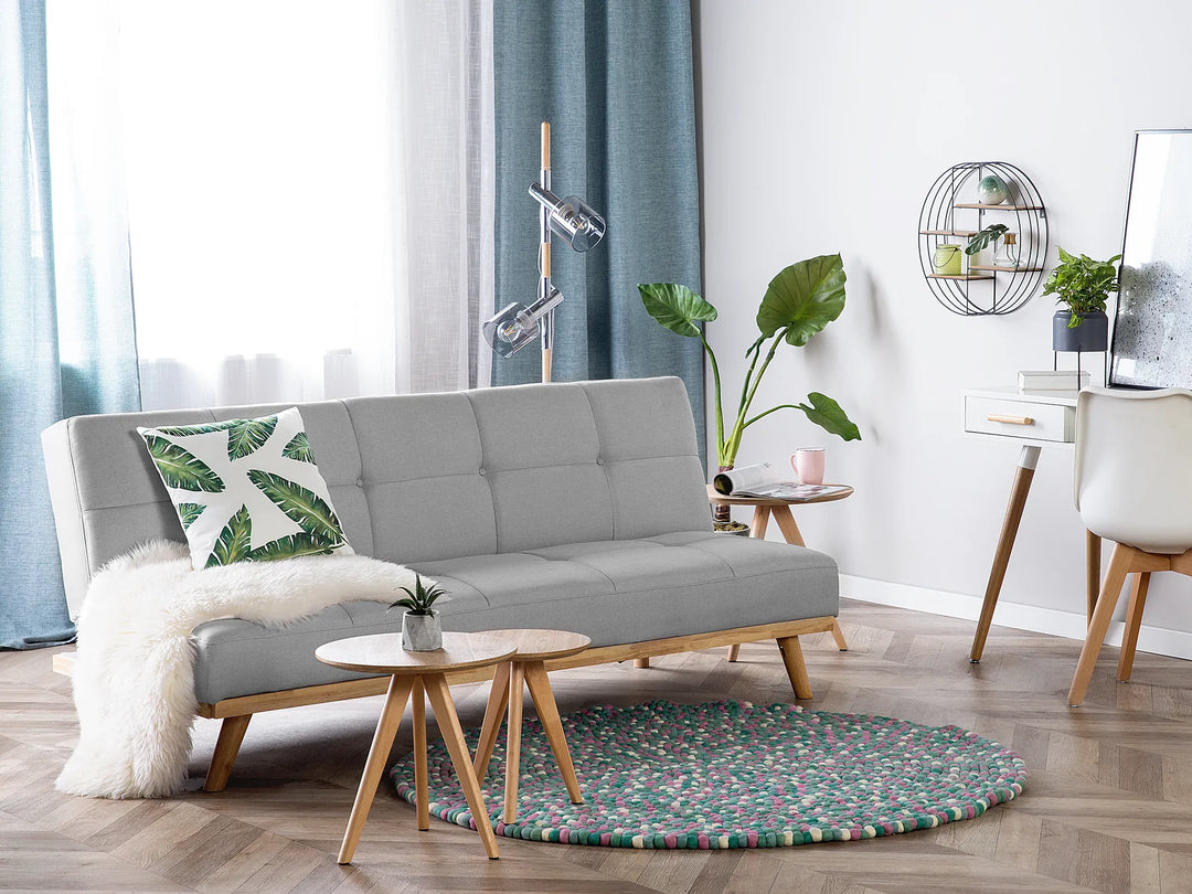 Minimalist light grey sofa bed with wooden legs