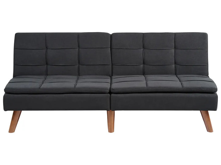 Black leather sofa with wooden legs on a white background