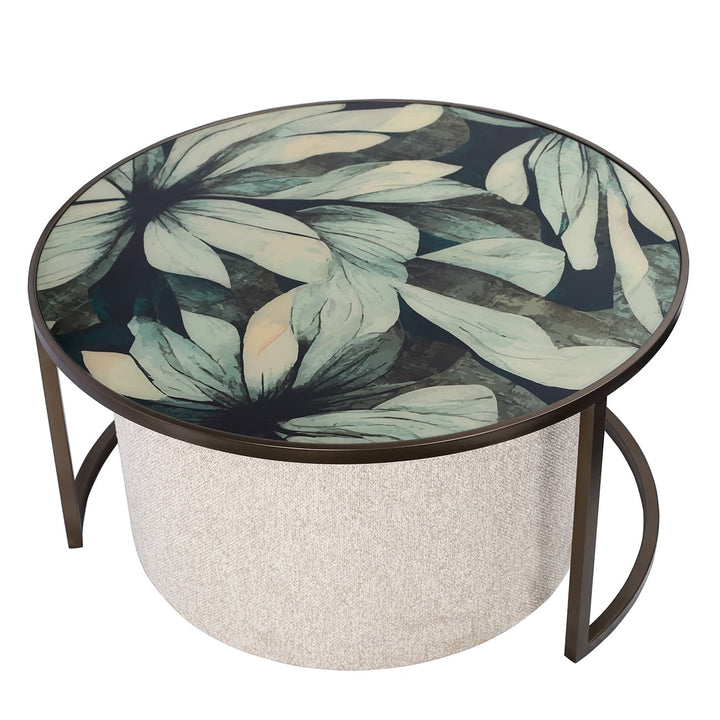 Round coffee table with floral patterned top and textured base 