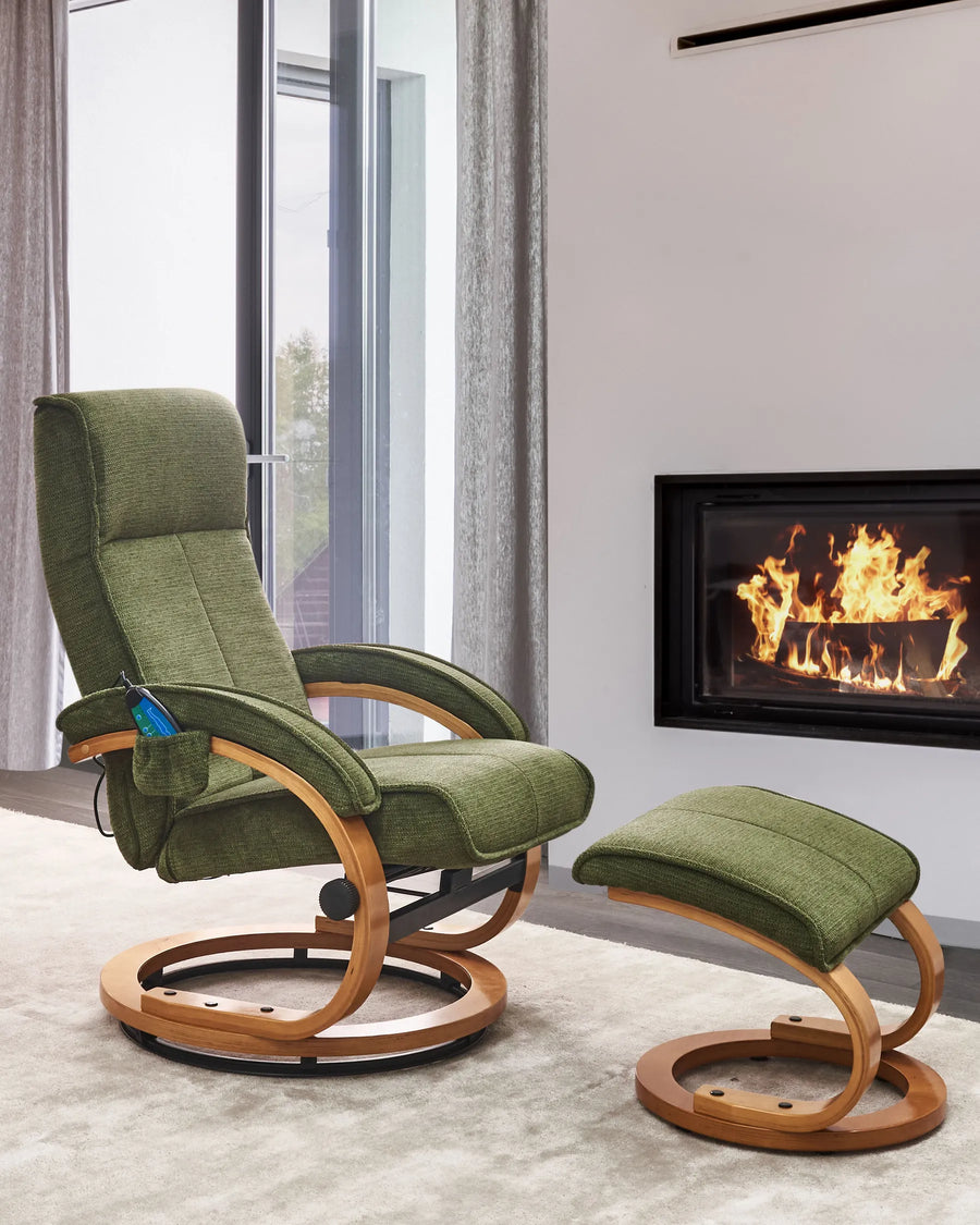 Green recliner chair with wooden frame and ottoman in front of a fireplace.