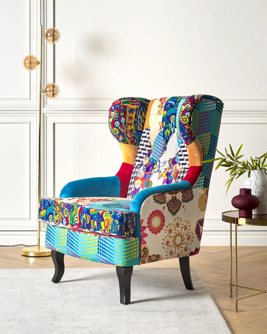 Colorful patterned armchair in a room with a lamp and small table.