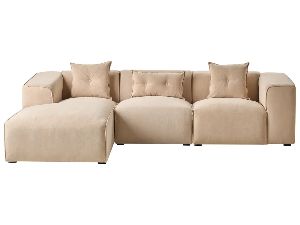 Beige sectional sofa with tufted backrests on a white background