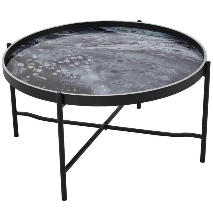 Round coffee table with moon surface design on a white background