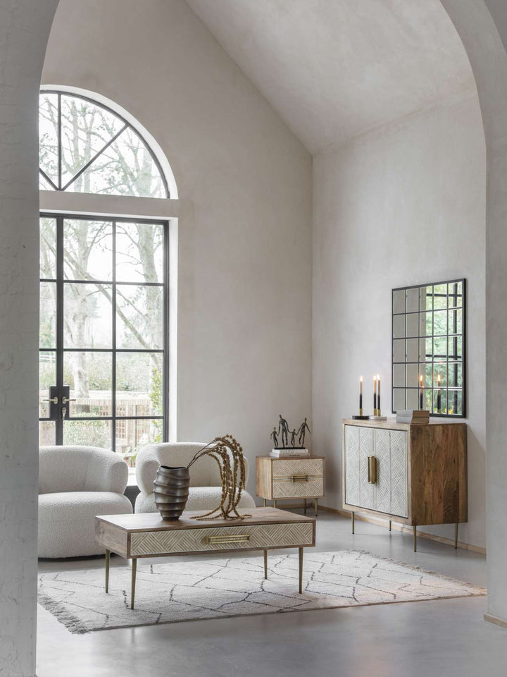 Modern living room with white walls, a large window, and decorative furniture.