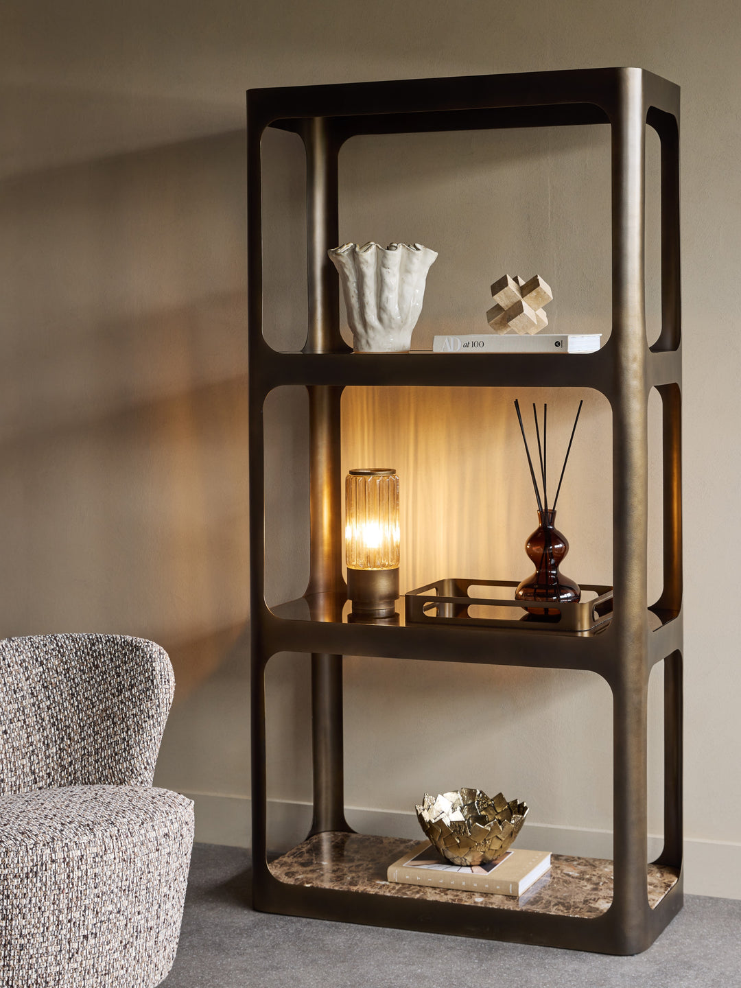 Dark wooden shelf with decorative items against a neutral wall