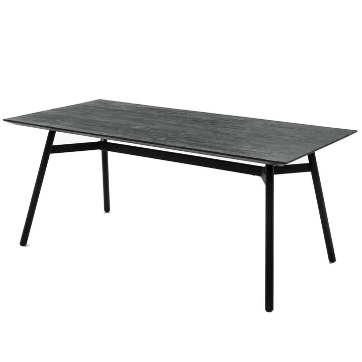Rectangular table with black metal legs and a dark gray top on a white background
