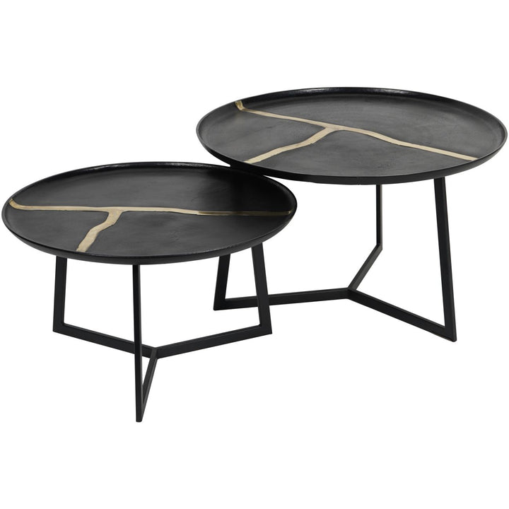 Set of two black coffee tables with gold accents on a white background