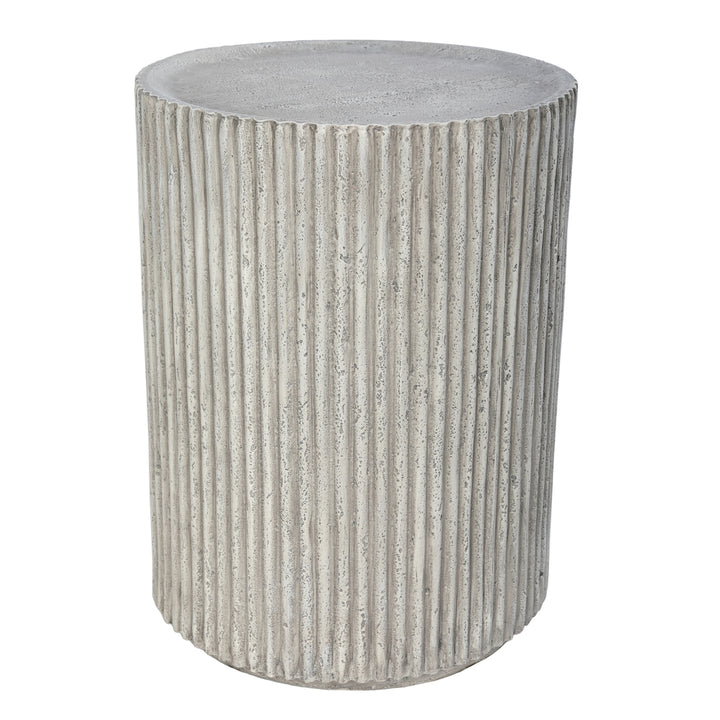 Textured cylindrical side table on a white background