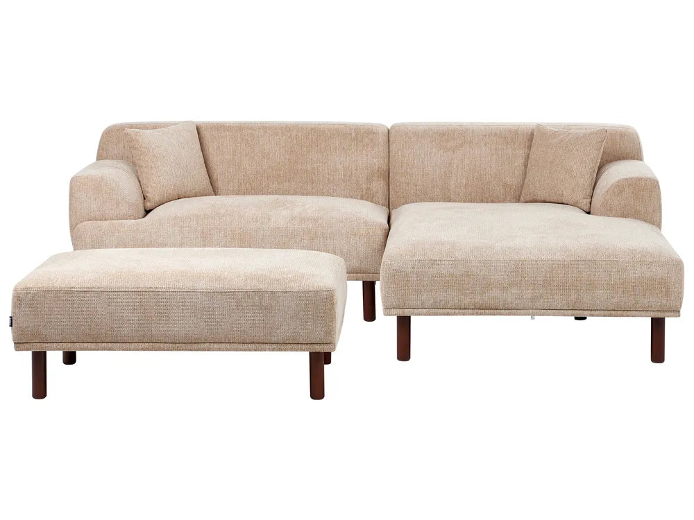 Beige sectional sofa with ottoman on a white background