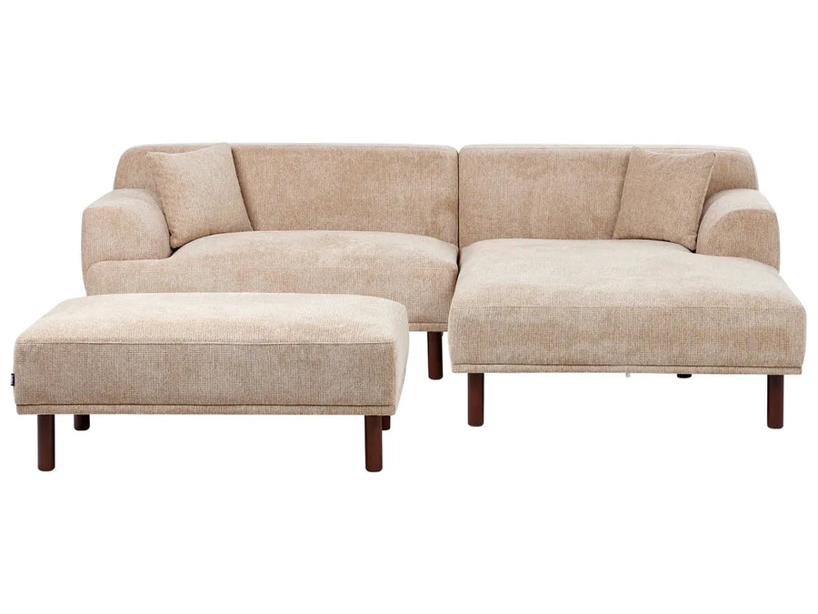 Beige sectional sofa with ottoman on a white background